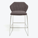 Modern-style bar stool with grey upholstery and classic design details.