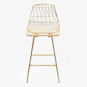 Contemporary wireframe chair with gold finish adds sleek sophistication.