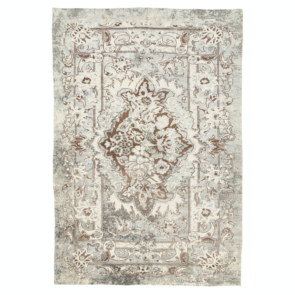 Elegant, vintage-inspired rectangular area rug with intricate floral patterns.