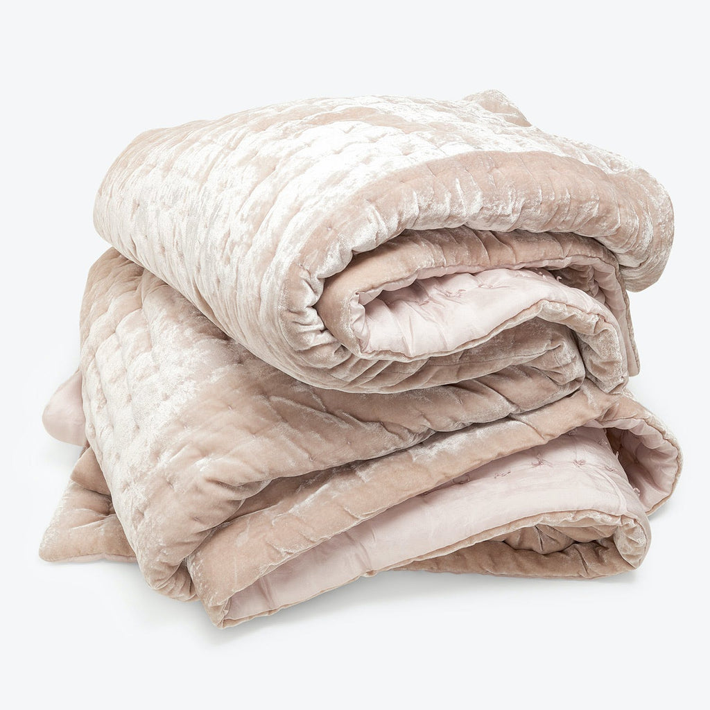 Soft, velvety blush pink blanket adds warmth and comfort.
