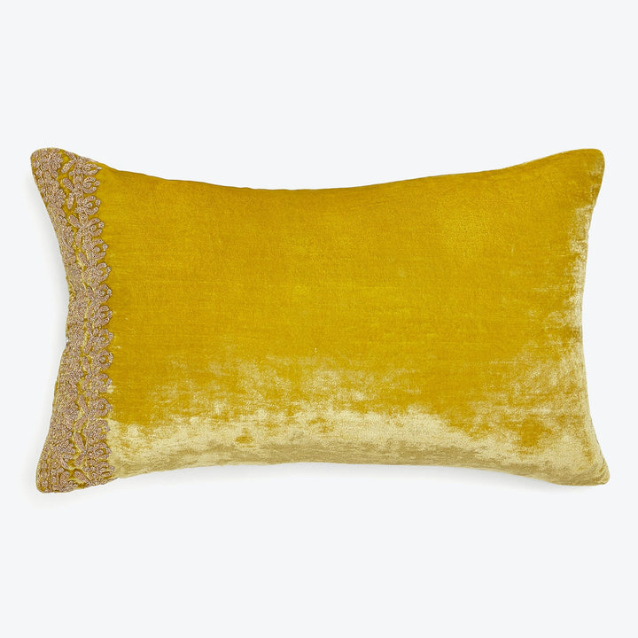 Elegant gradient throw pillow with lace trim adds luxurious touch.