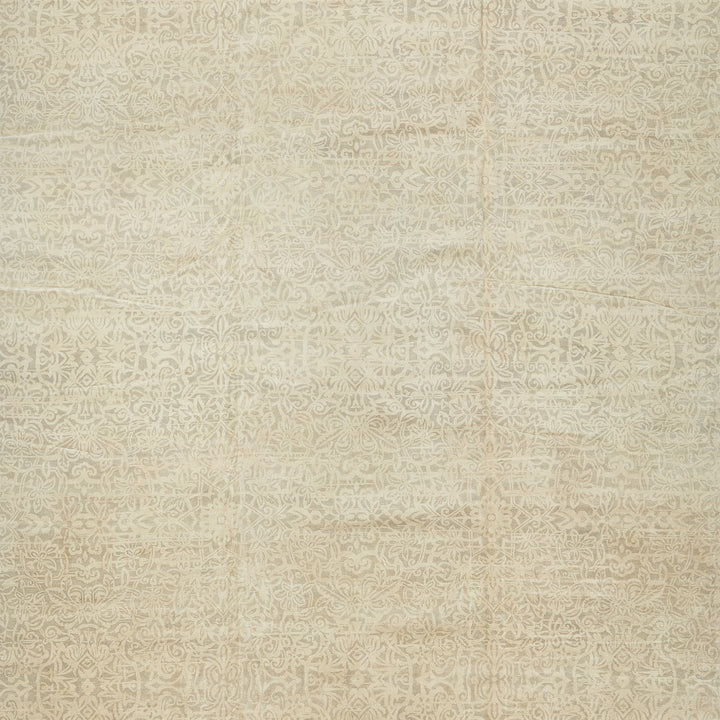 Intricate floral-inspired pattern on muted surface, possibly for interior decor.