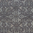 Traditional, intricate fabric pattern with muted colors and symmetrical design.