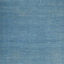 Textured blue surface resembling painted or weathered material with brush strokes
