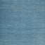 Textured blue surface resembling painted or weathered material with brush strokes