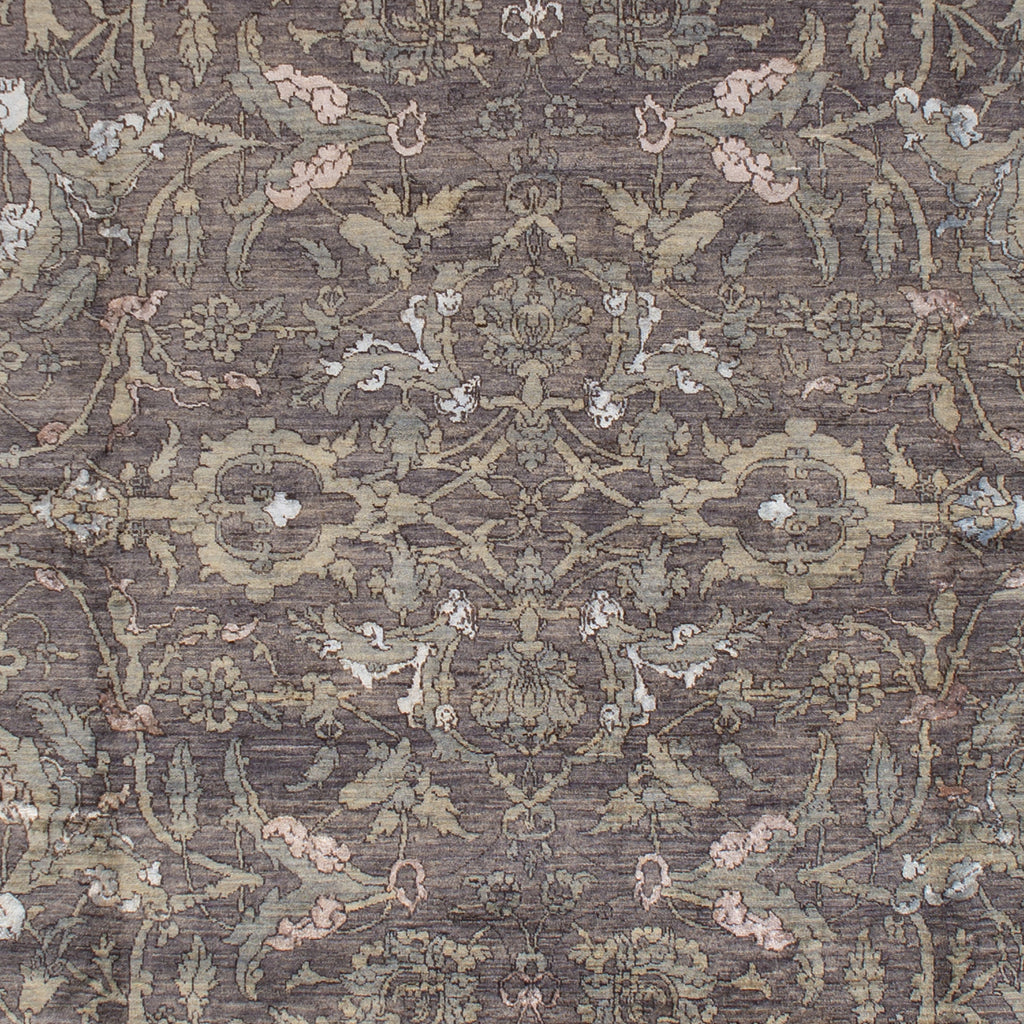 Intricate floral and vegetative motifs create a vintage rug design.