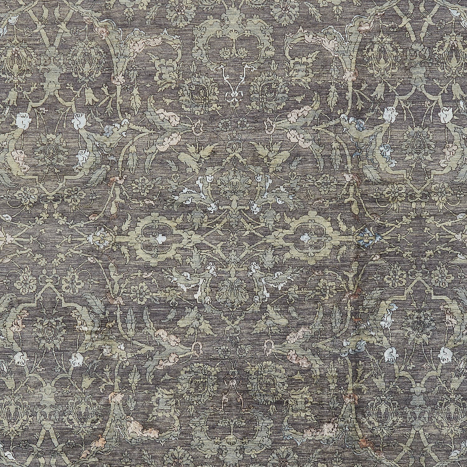 Antique textile showcasing intricate vintage patterns in muted shades.