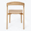 Minimalist wooden chair with ergonomic design, suitable for modern spaces.