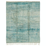 Blue woven textile with organic pattern and fringe details.