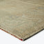 Neutral-toned woven rug with intricate patterns and plush texture