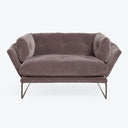 Contemporary dusty rose sofa with plush velvet upholstery and metal legs