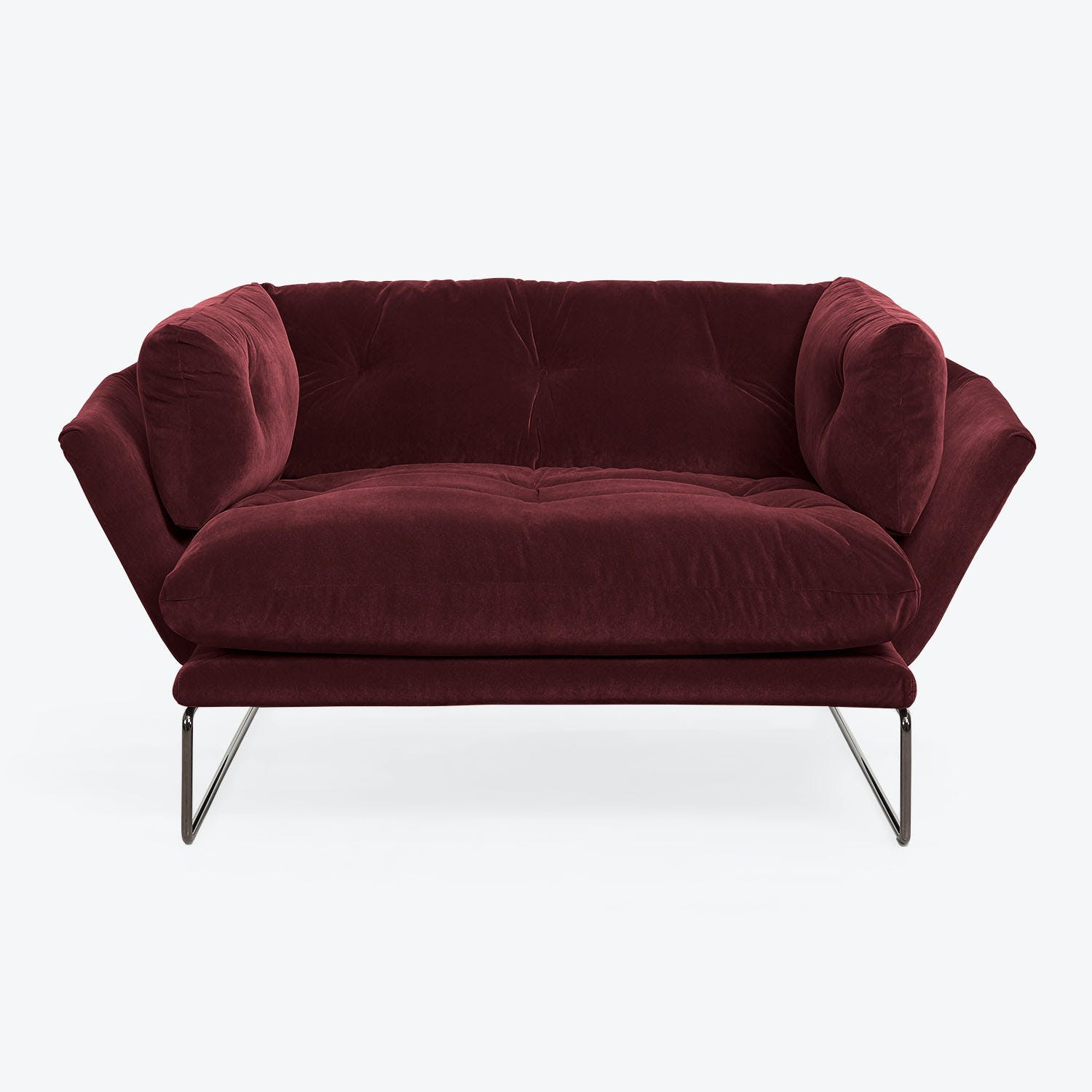 Modern burgundy velvet sofa with plush cushioning and sleek frame.