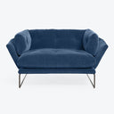 Contemporary deep blue velvet sofa with sleek metal frame legs