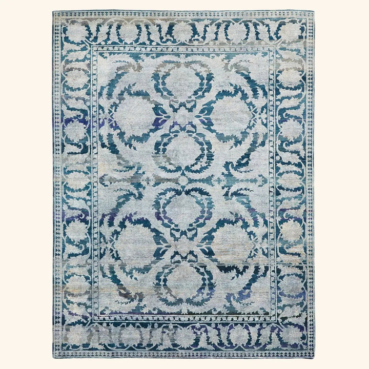 Vintage-style rectangular area rug with ornate blue symmetrical design.