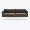Contemporary and luxurious dark gray sofa with sleek metallic legs.