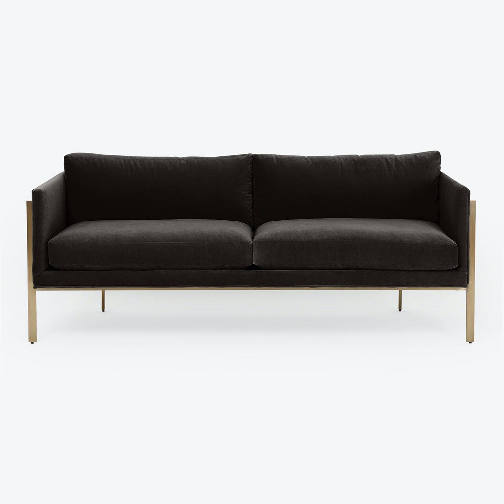 Minimalist two-seater sofa with dark upholstery and sleek metallic legs.