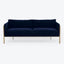 Modern, sleek blue sofa with clean lines and metal accents.