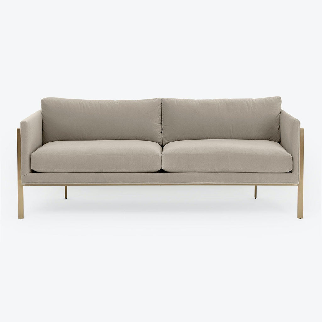 Minimalist modern sofa with plush cushions and metallic legs