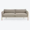 Minimalist modern sofa with plush cushions and metallic legs