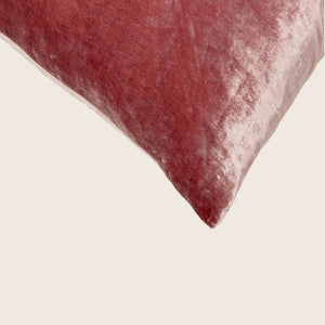 Dusty rose velvet cushion with subtle sheen and visible seam. - hover