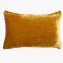 Mustard-yellow velvet cushion with plush texture, perfect for home decor.