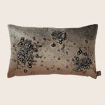 Rectangular decorative pillow with gradient color design and water droplet effects.