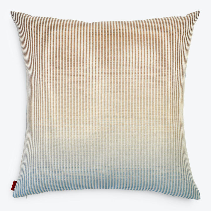 Square pillow with striped pattern in shades of beige, cream, and blue