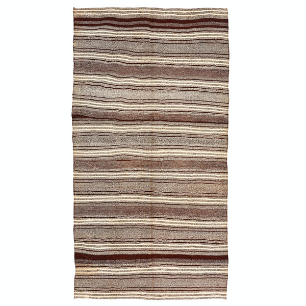 Horizontal striped rug with natural colors adds warmth and texture.