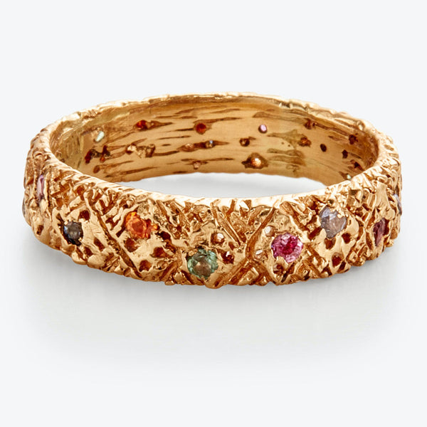 Exquisite golden bracelet adorned with colorful gemstones in unique design