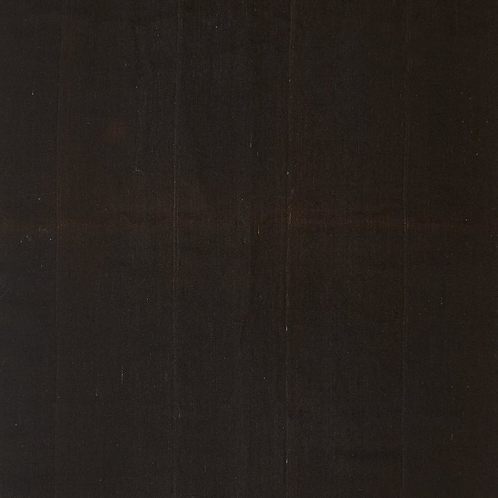 Close-up of a dark wooden plank with visible natural grain.