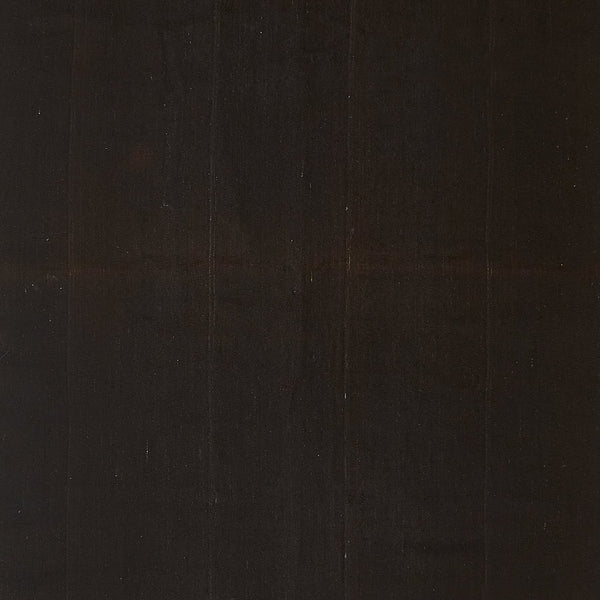 Close-up of a dark wooden plank with visible natural grain.