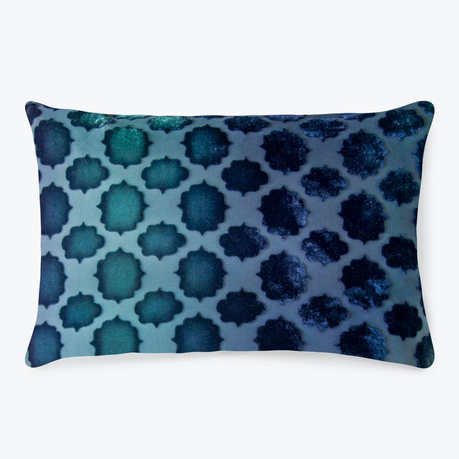 Rectangular pillow with a gradient pattern of stylized flower shapes.