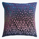 Vibrant geometric pillow with a gradient color scheme adds flair