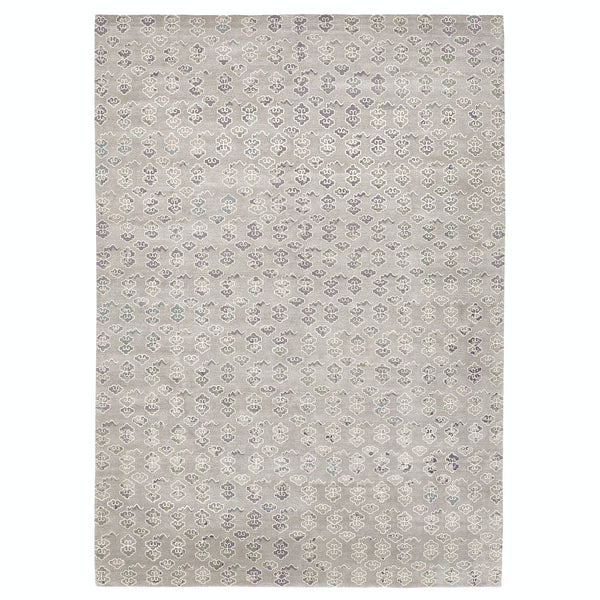 Rectangular rug with elegant floral motifs in muted gray tones.