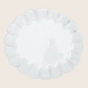 Elegant white plate with textured surface and ruffled rim design.