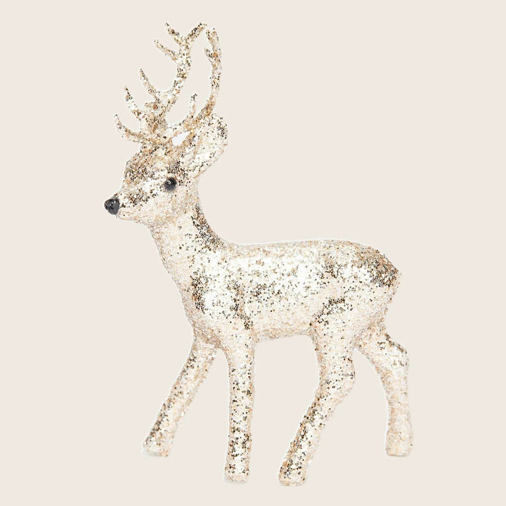 Glittery deer figure adds festive touch to holiday decorations.