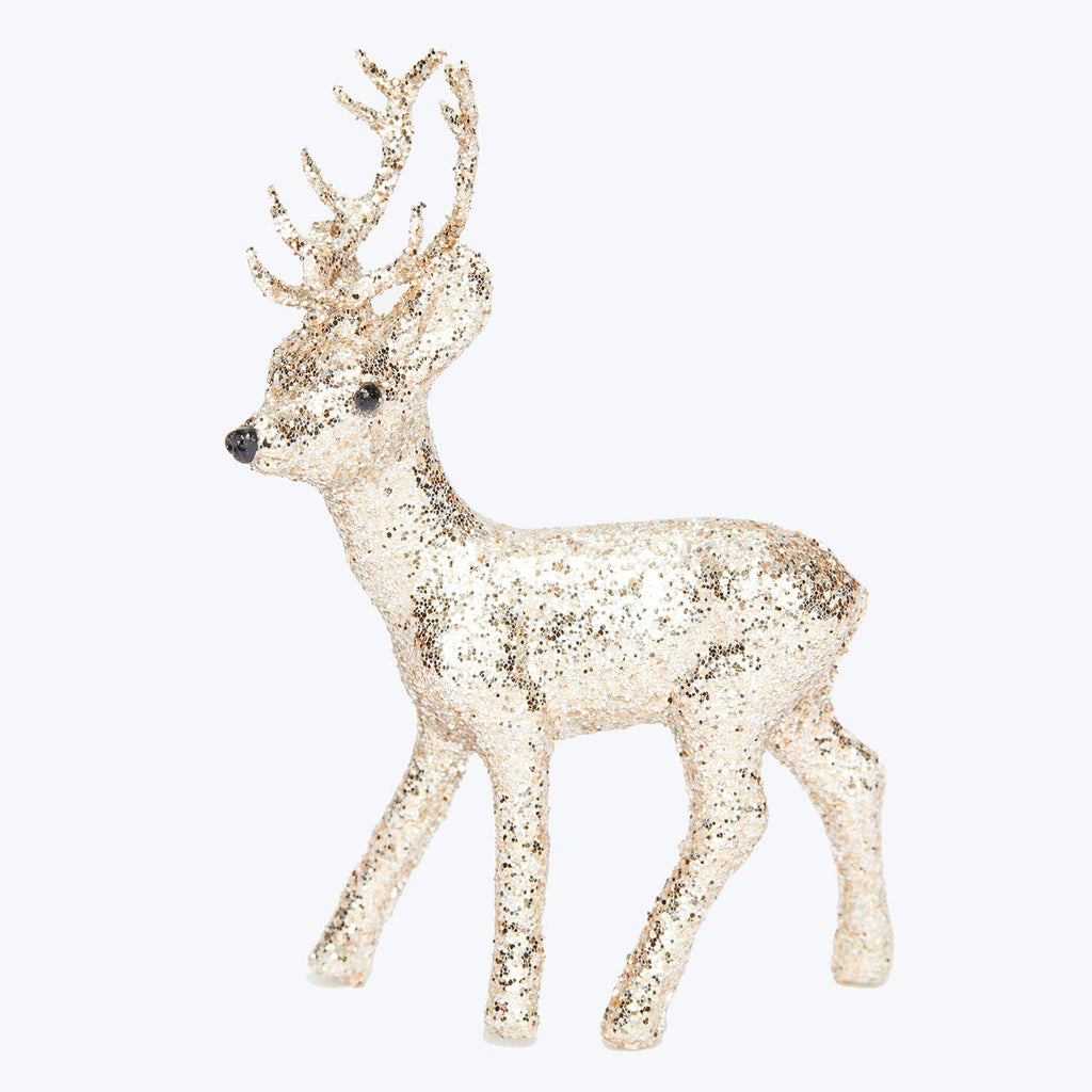 Glittery deer figure adds festive touch to holiday decorations.