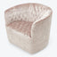 Elegant, plush barrel chair in soft pink velvet upholstery design