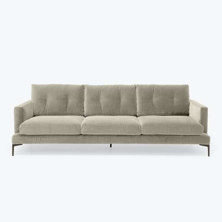 Modern, minimalist sofa with plush cushions and sleek design