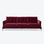 Contemporary three-seater sofa with plush burgundy velvet upholstery design.