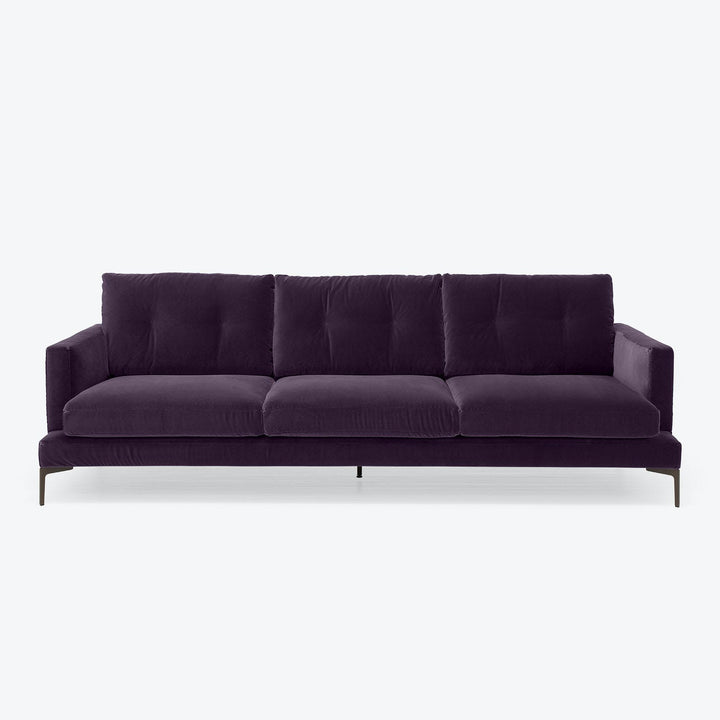 Contemporary and luxurious dark purple sofa with clean design.