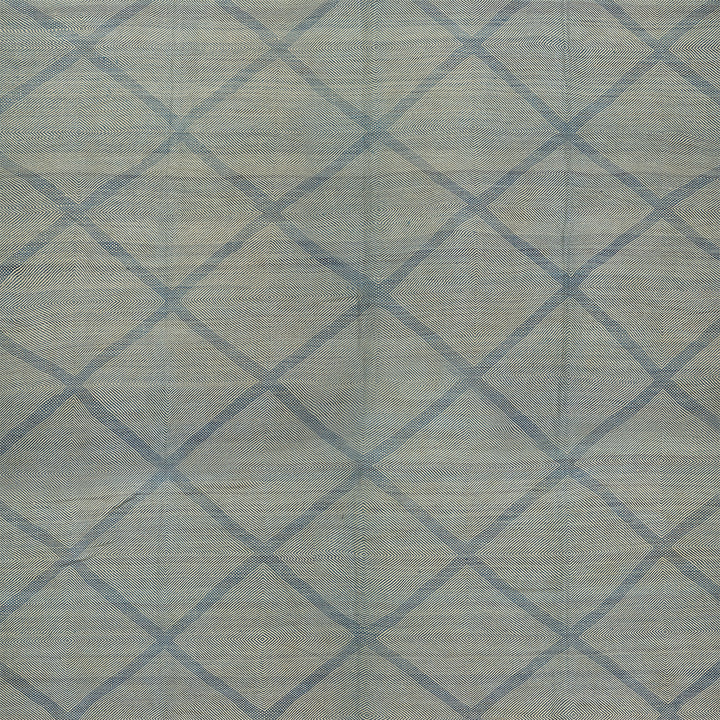 Geometric lattice patterned fabric in muted blue and grey shades.