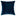 Deep blue velvet square pillow exudes elegance against white backdrop.