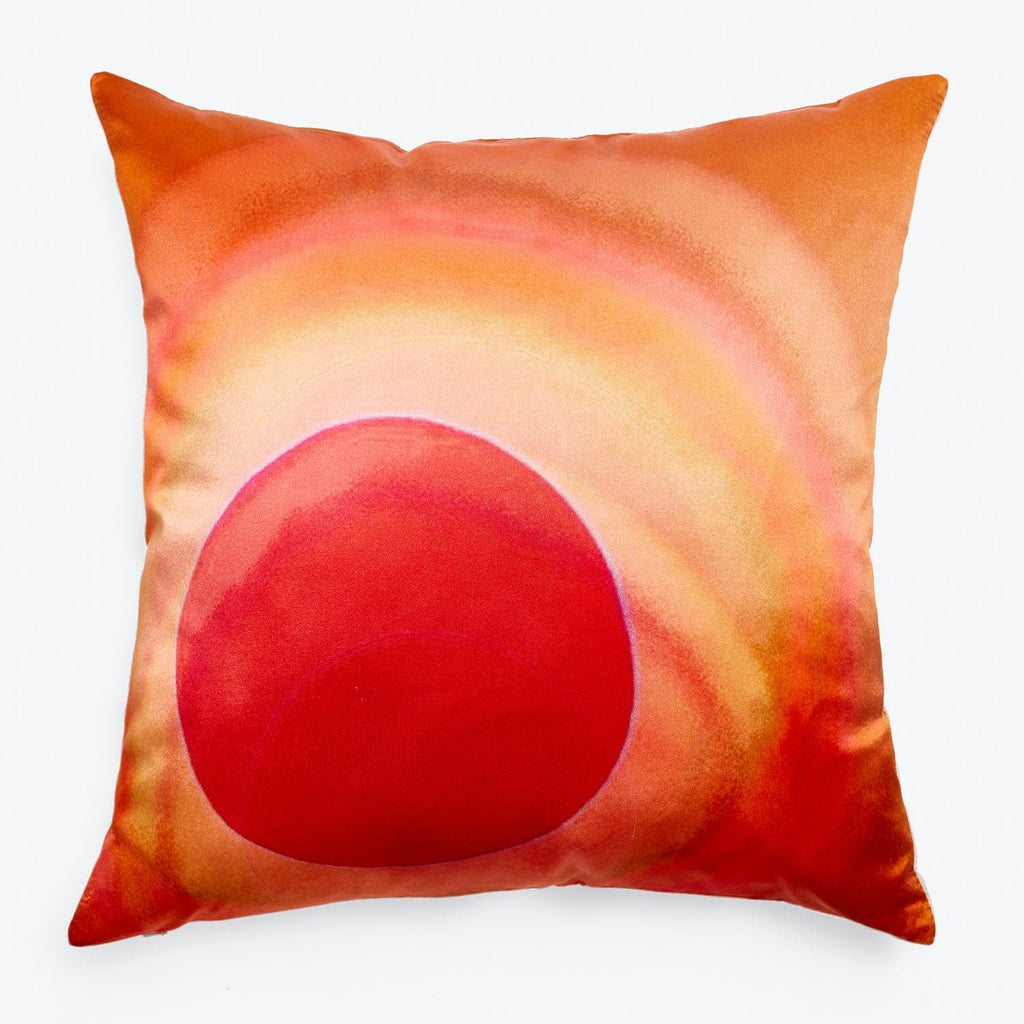 Square pillow with sunset-inspired design featuring a radiant reddish sun.