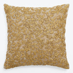 Square decorative pillow with gold embroidered foliage design exudes elegance.