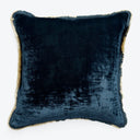 Luxurious navy velvet throw pillow with fringed tan edges.