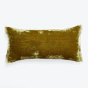 Luxurious olive green plush pillow with fringe detail on white background