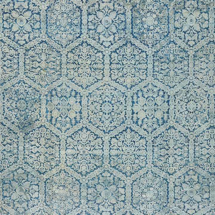Intricate blue mosaic pattern with vintage floral and foliate motifs.