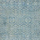 Intricate blue mosaic pattern with vintage floral and foliate motifs.