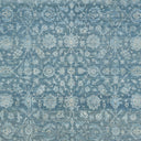 Intricate blue and white textile with vintage ornamental floral pattern.